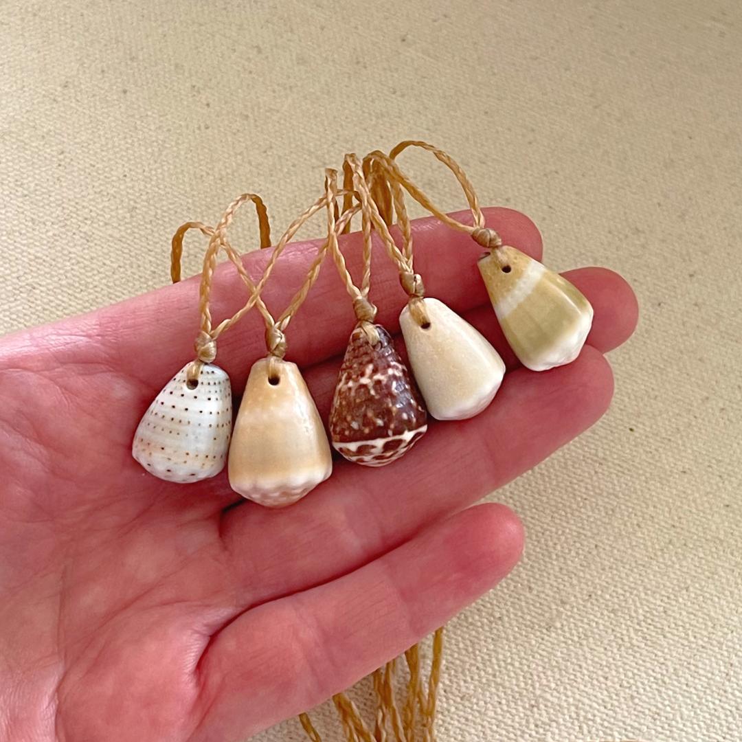 Seashell Beach Necklaces. Hawaiian cone shells simply strung on waxed cord.