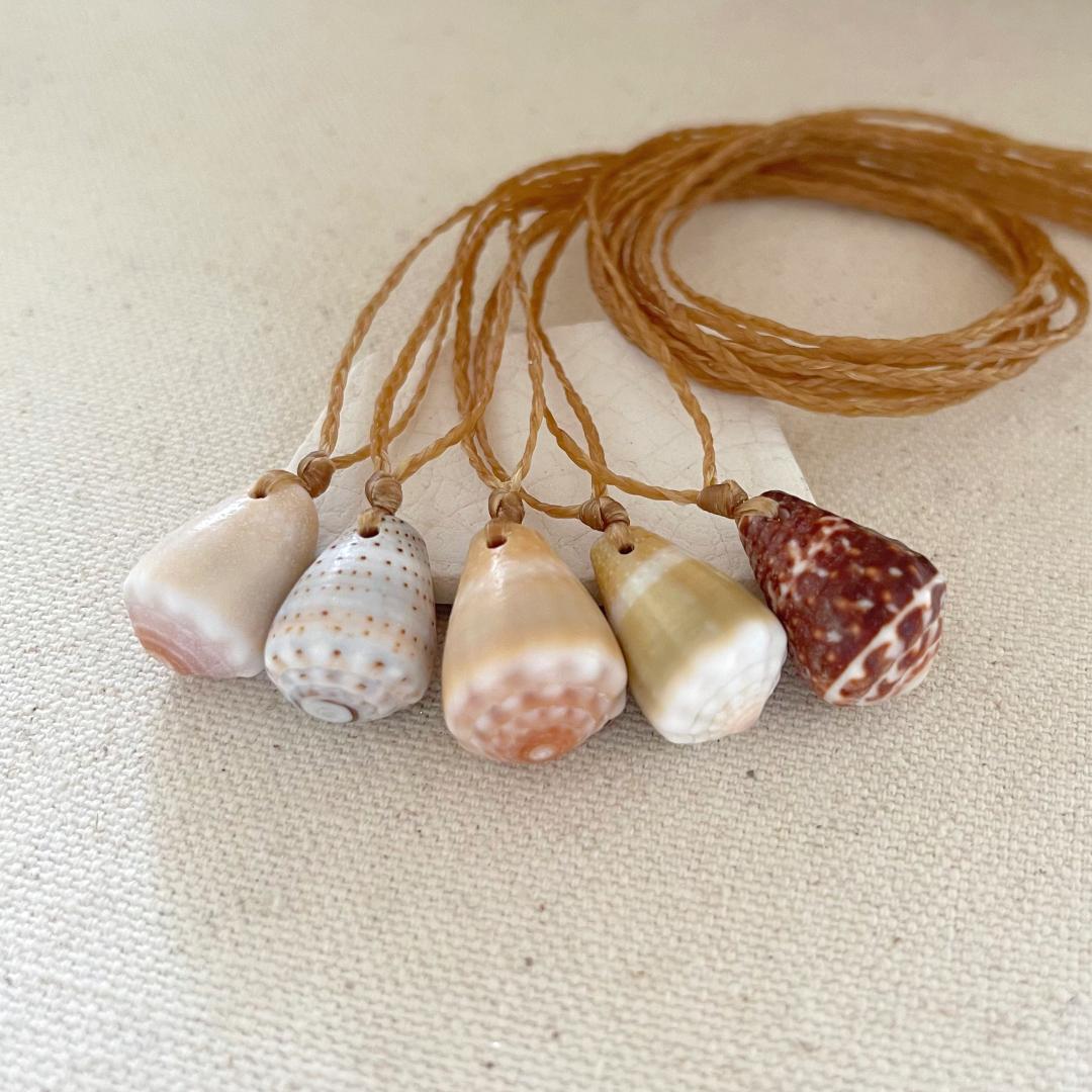 Seashell Beach Necklaces. Hawaiian cone shells simply strung on waxed cord.