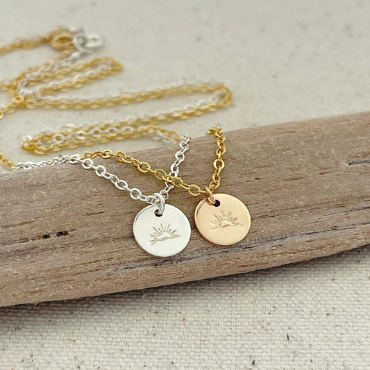 Hand stamped ocean sunset on either sterling silver or 14 goldfilled 9.5mm disc on sterling silver or 14K gold-filled chain in your choice of length.
